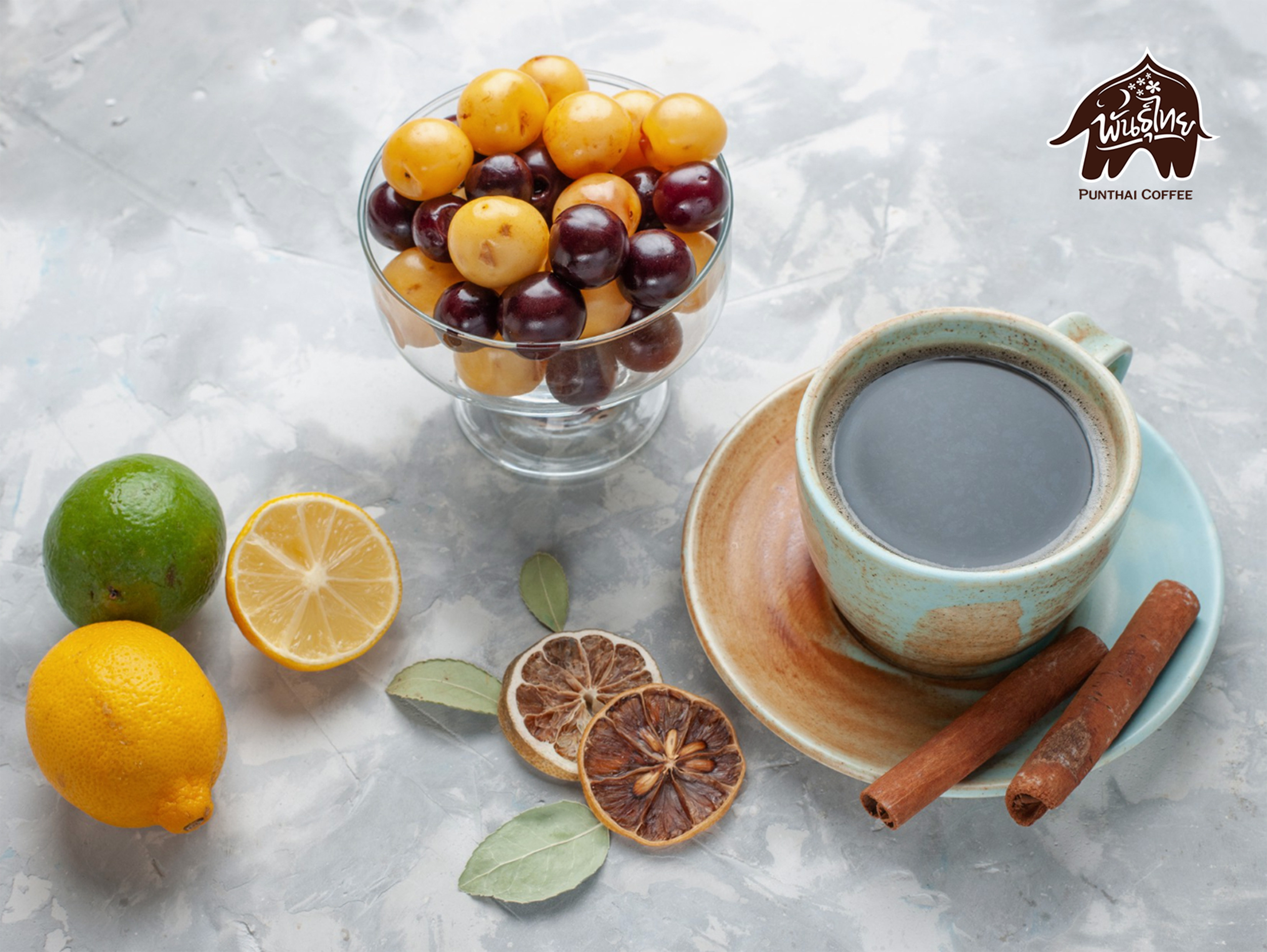 cup of tea with cinnamon lemon and cherries