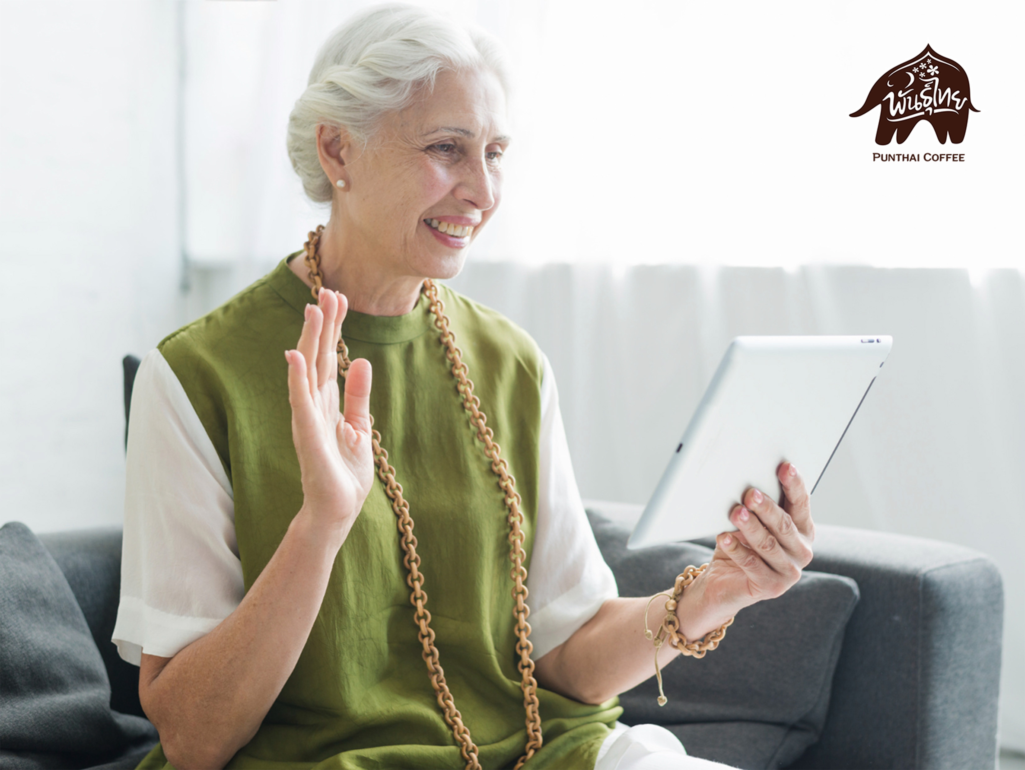 senior business woman is playing a tablet