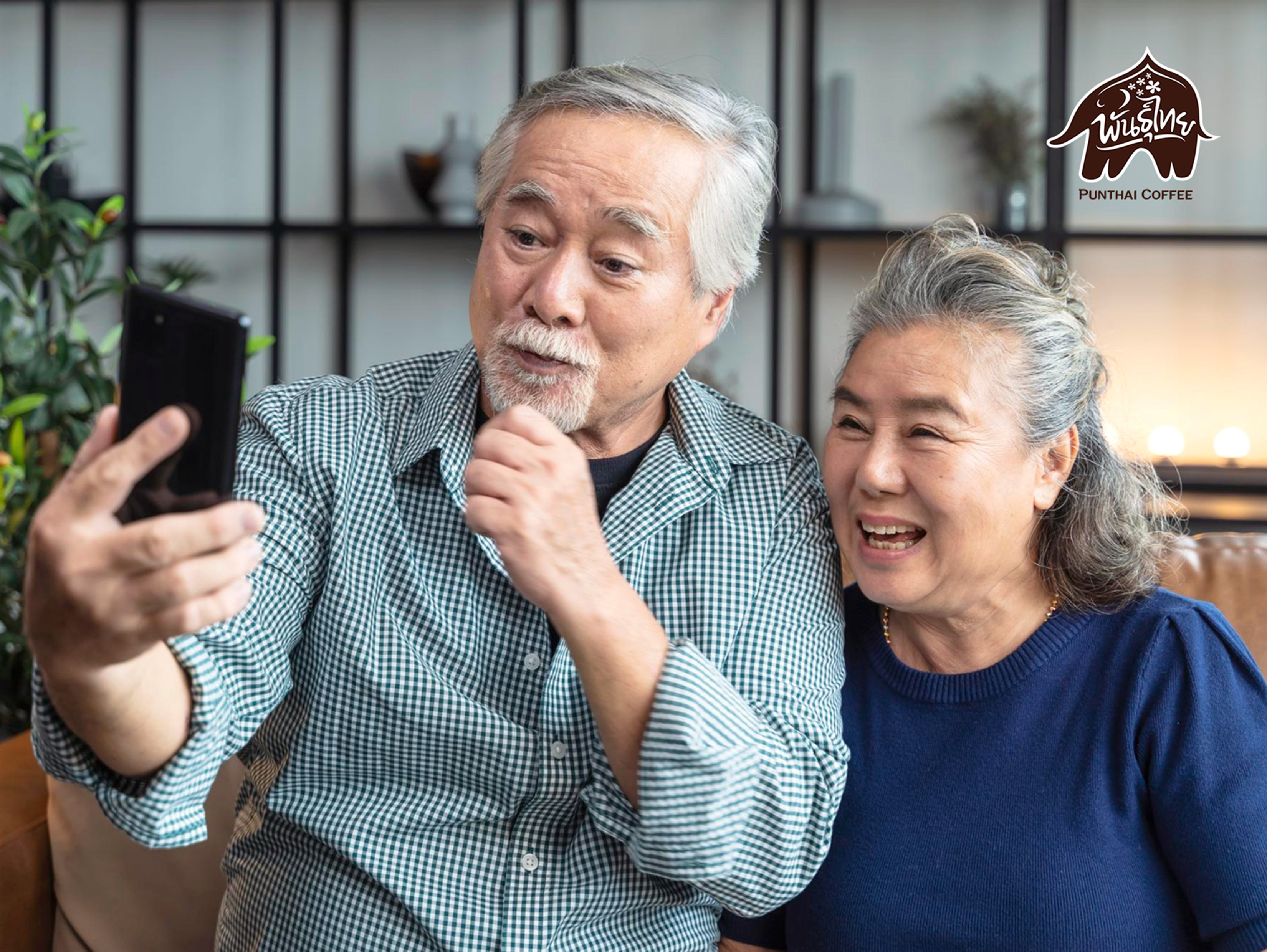 senior asian couple is playing a smartphone